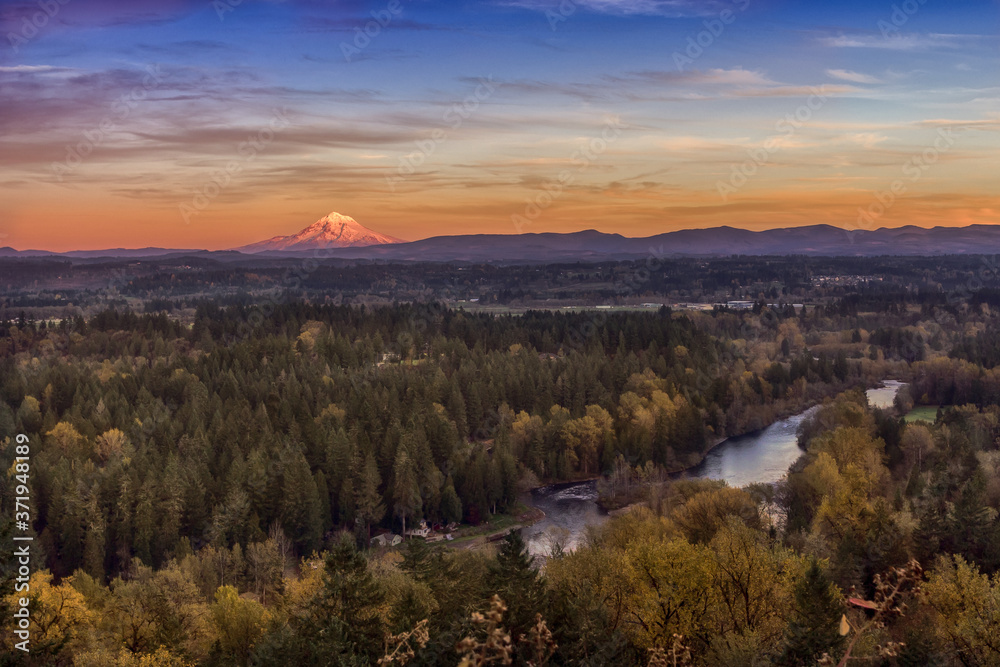 Autumn river landscape. Clackamas river and Mount Hood on distance. Oregon, USA