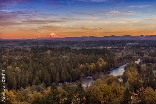 Autumn river landscape. Clackamas river and Mount Hood on distance. Oregon, USA