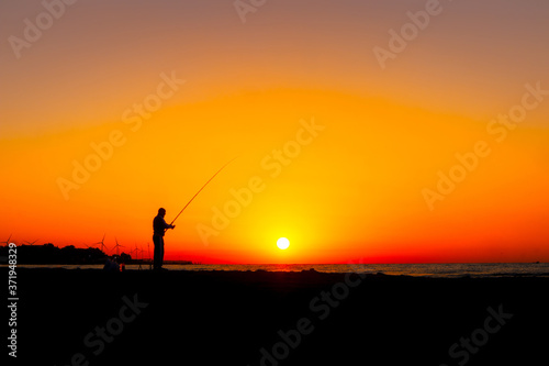 fisherman and fishing at sunrise