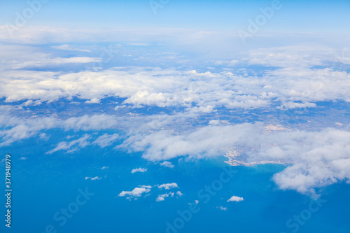Landscape with white clouds and blue sea