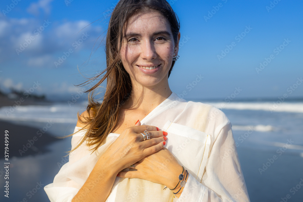 Close up portrait of beautiful woman with jewelry. Happy Caucasian woman at the beach. Beauty and fashion concept. Travel lifestyle.