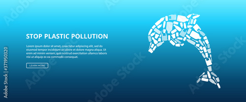 White dolphin shape made of plastic bottles and bags with other garbage