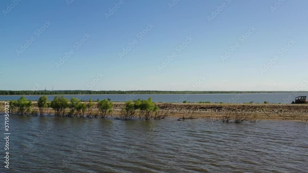 Empty and Long Road In Middle Of Lake, Aerial Reveal Empty and Long Road In Middle Of Lake, Aerial Reveal