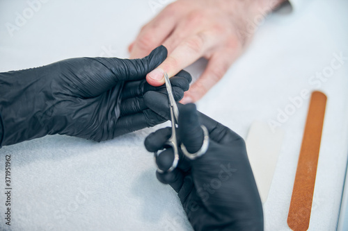 Close up of female hands while doing manicure