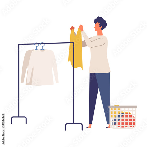 Vector illustration of man using a hanging the laundry. Man doing housework.