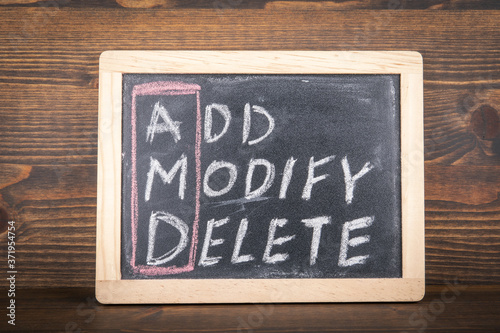 AMD. ADD, MODIFY and DELETE. Business concept. Chalk board with an inscription photo