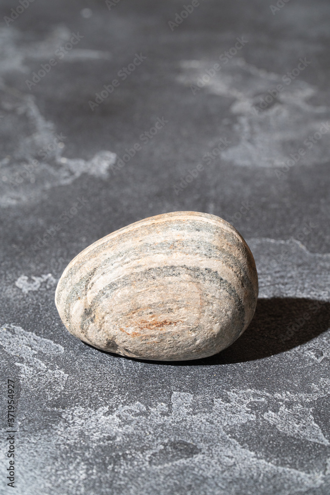 Pebble stone on the concrete surface. Copyspace. Pebble stone on the concrete surface. Copyspace.