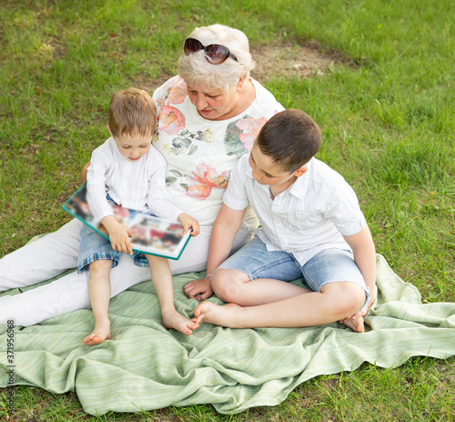 Smilling senior woman with grandchildren enjoying time together  © elenbessonova