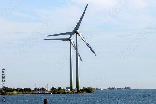 Windmills With Sun Flare At Marken The Netherlands 6-8-2020