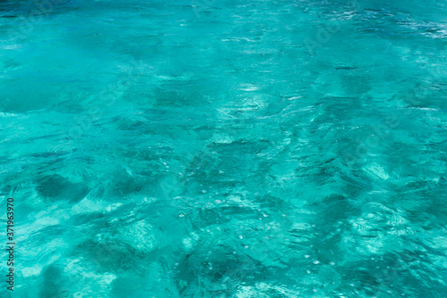 Tropical turquoise blue ocean water. Caribbean shining blue water background