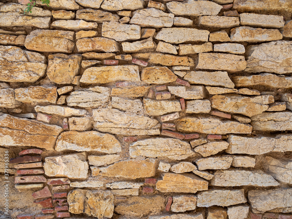 Fototapeta premium Real antique spanish stone wall background texture