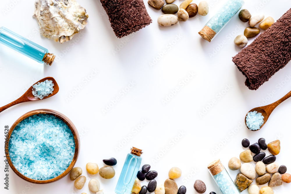 Frame of wellness set of spa cosmetics with sea salt and stones Frame of wellness set of spa cosmetics with sea salt and stones