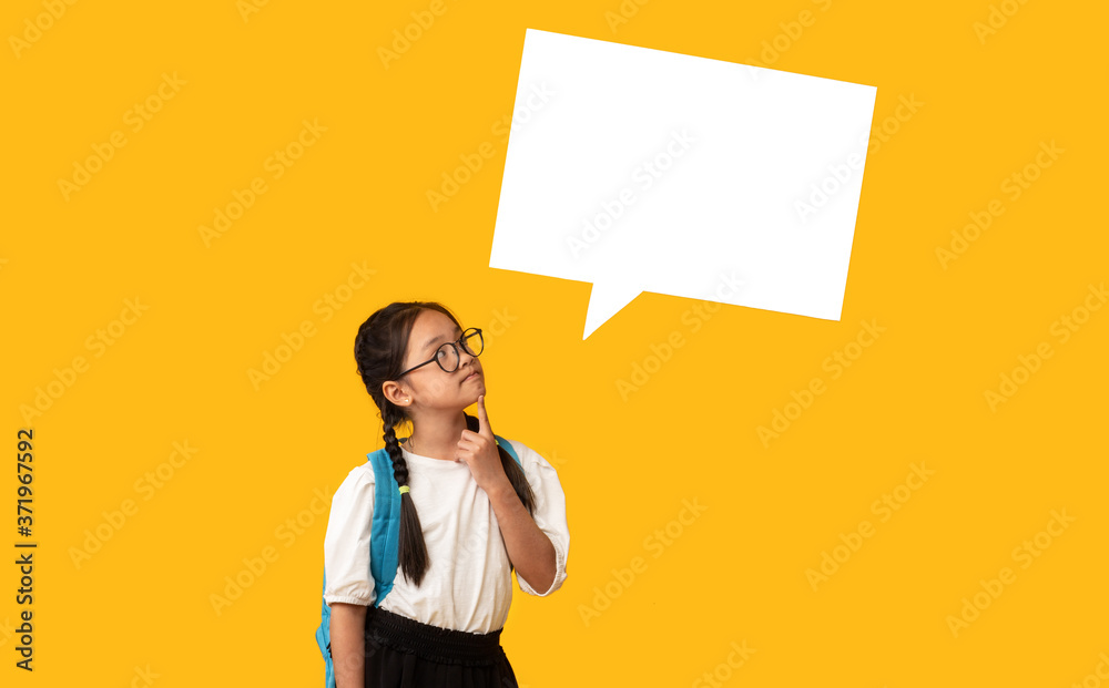 Asian Girl Thinking With Speech Bubble Above Head, Yellow Background Asian Girl Thinking With Speech Bubble Above Head, Yellow Background