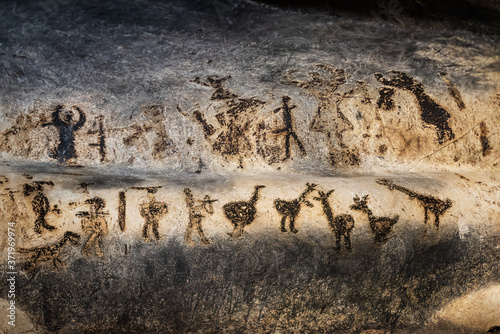 Prehistoric art wall cave paintings dating from Epipaleolithic (Stone Age), Neolithic (New Stone Age), Eneolithic (Stone-Copper Age) and the Early Bronze Age, the Magura cave in Bulgaria. photo