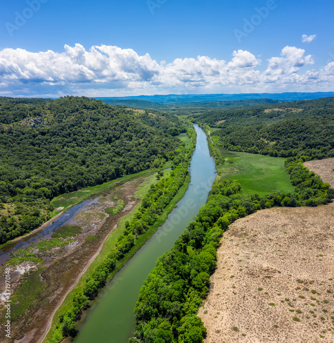 Aerial view of the picturesque curves of a river among lush vegetation that flows into the sea  Ropotamo River in Ropotamo Nature Reserve  Strandzha Mountain