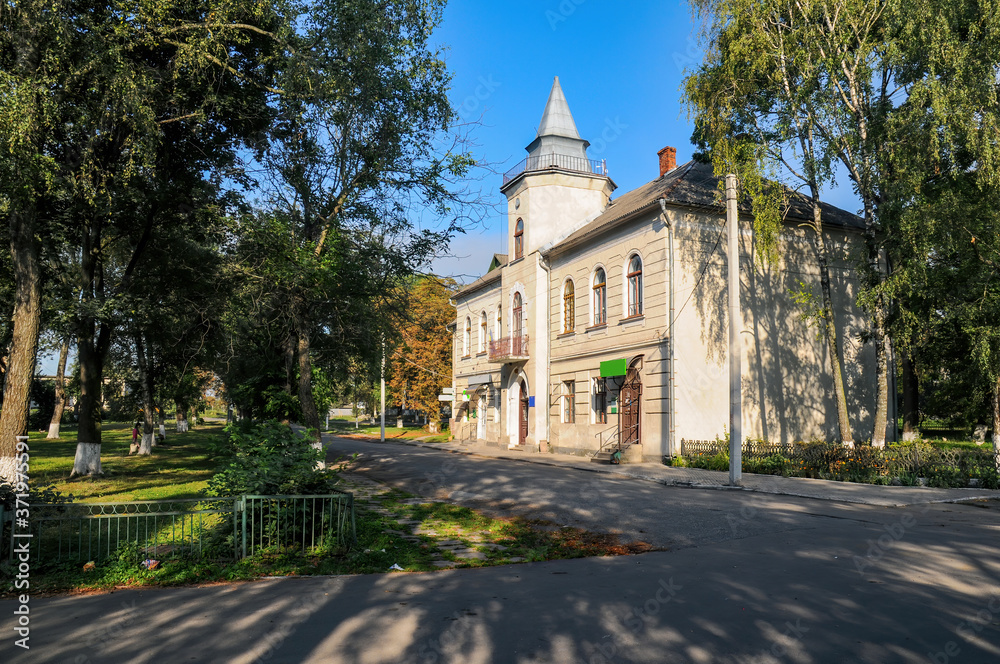 Historical town hall in Bilshivtsi, Ivano-Frankivsk region, Ukraine at sunny summer morning