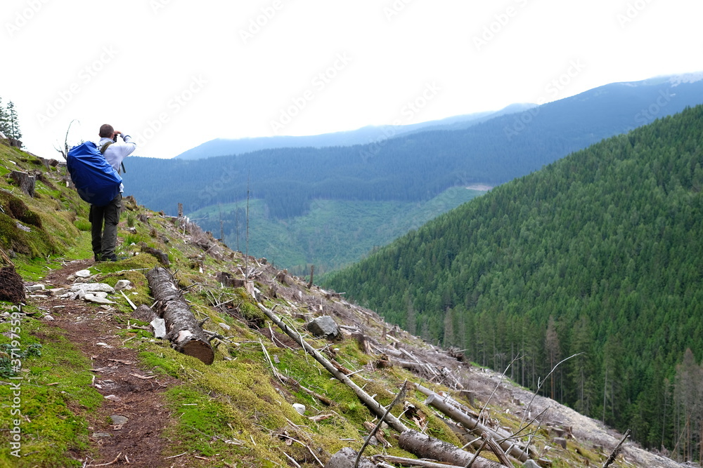 Traveler walking in the mountains.  Trekking journey and travel concept