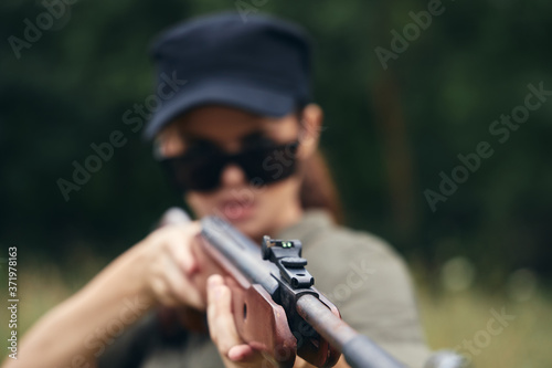 Woman holding a gun sight hunting weapons 