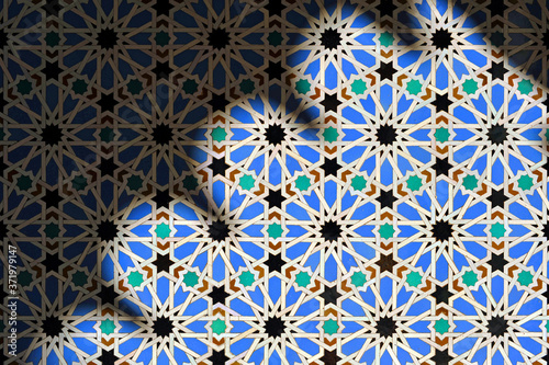 Azulejos of Al Andalus Alcazar of Seville Spain. Play of light and shadow in architecture. Arab pattern decoration