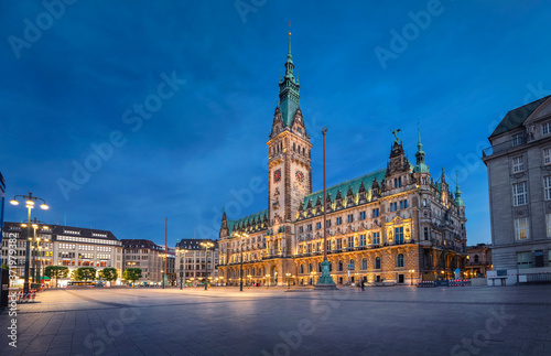 Hamburg, Germany. View of illuminated Town Hall building at dusk located on Rathausmarkt square photo