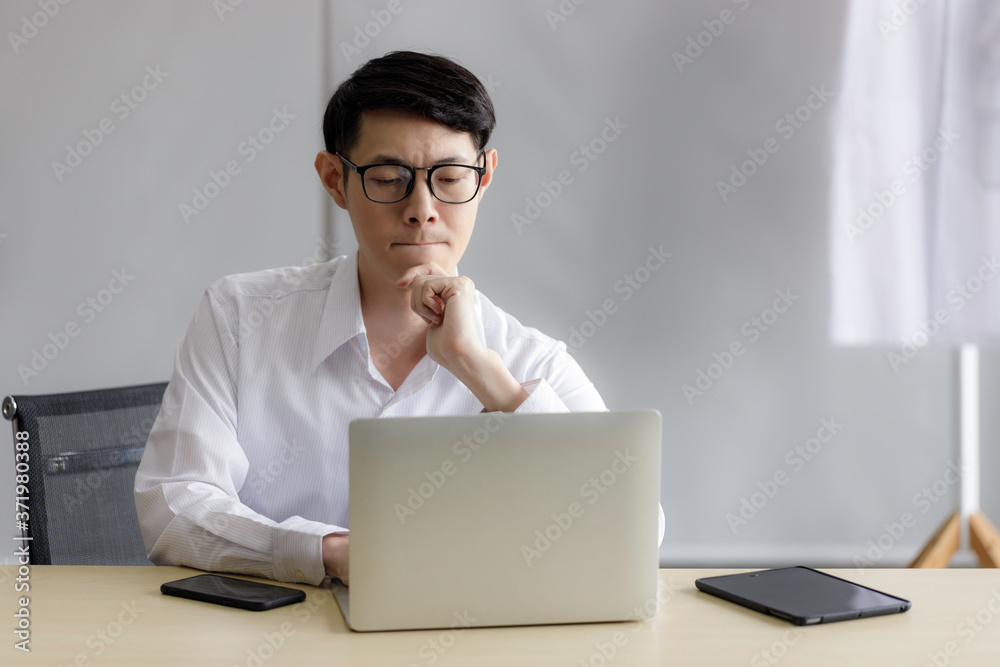 Male doctors in uniform are using laptops for medical work at modern hospital. Male doctors in uniform are using laptops for medical work at modern hospital.