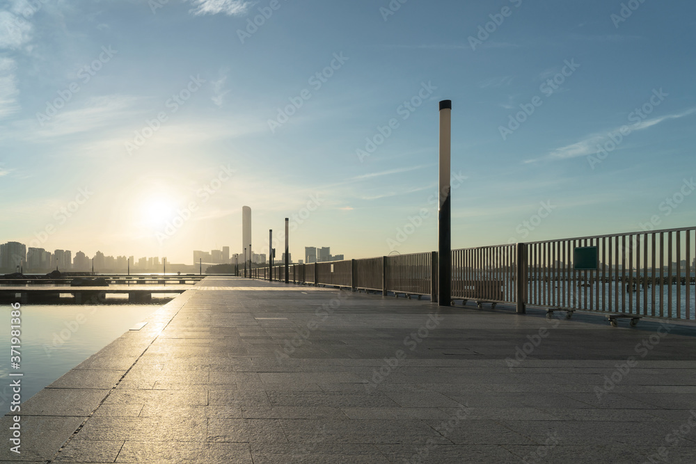 Empty concrete platform on a sunny morning.
