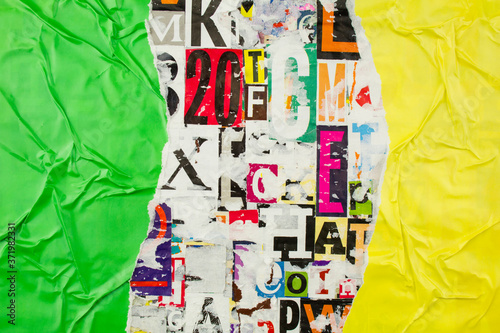 Slika na platnu Torn and crumpled green and yellow glossy paper on abstract colorful collage of magazine paper pieces and clippings with letters and numbers background