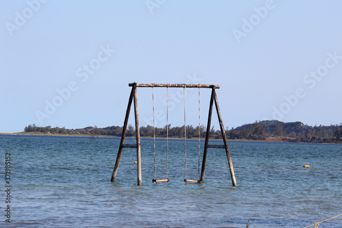 Bilene, Gaza, Mozambique - July, 2020 - the coast of Mozambique, a playground into the lagoon, next to the sea. Blue sky and clean water 