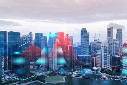 Forex and stock market chart hologram over panorama city view of Singapore, the financial center in Asia. The concept of international trading. Double exposure.