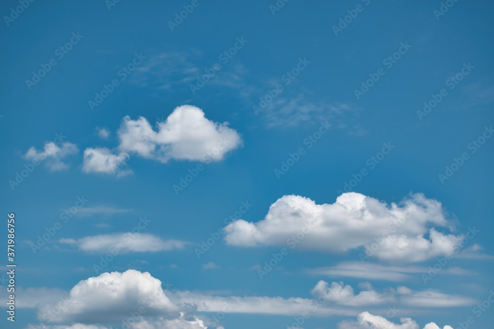 Beautiful blue sky with with light puffy cirrus clouds background Beautiful blue sky with with light puffy cirrus clouds background