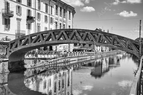 Bridge on Naviglio Grande, Naviglio Grand canal full with restaurants, bars and people in Milan