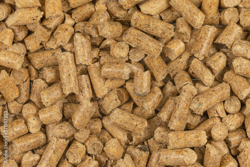 Brown wood pellets texture background. natural pile of wood pellets. organic biofuels. Alternative biofuel from sawdust. The cat litter. pile of compressed wood pellets.