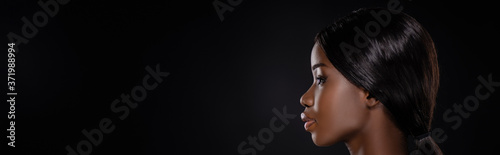profile of african american woman isolated on black, panoramic shot