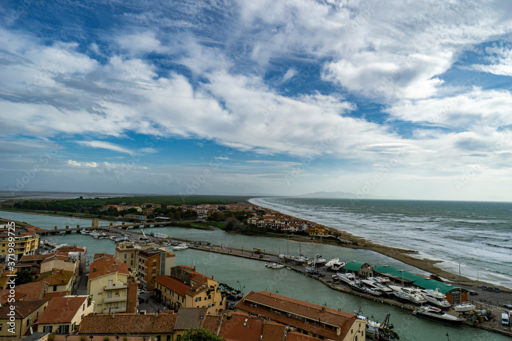 Italy Tuscany Maremma Castiglione della Pescaia, period of flood, panoramic view of the coast of the port entrance
