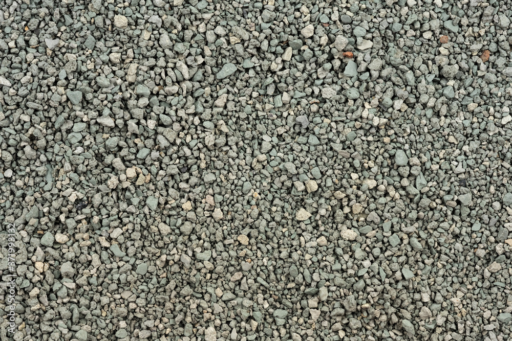 Gray small rocks ground texture. black small road stone background. gravel pebbles stone seamless texture. dark background of crushed granite gravel, close up. clumping clay Gray small rocks ground texture. black small road stone background. gravel pebbles stone seamless texture. dark background of crushed granite gravel, close up. clumping clay