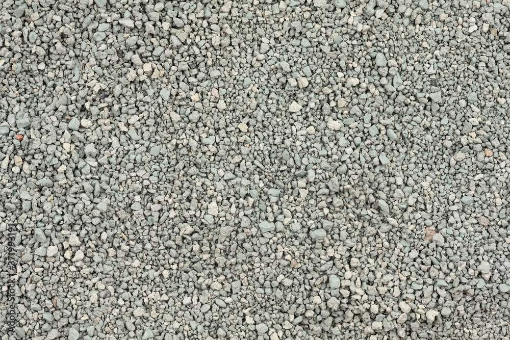 Gray small rocks ground texture. black small road stone background. gravel pebbles stone seamless texture. dark background of crushed granite gravel, close up. clumping clay Gray small rocks ground texture. black small road stone background. gravel pebbles stone seamless texture. dark background of crushed granite gravel, close up. clumping clay