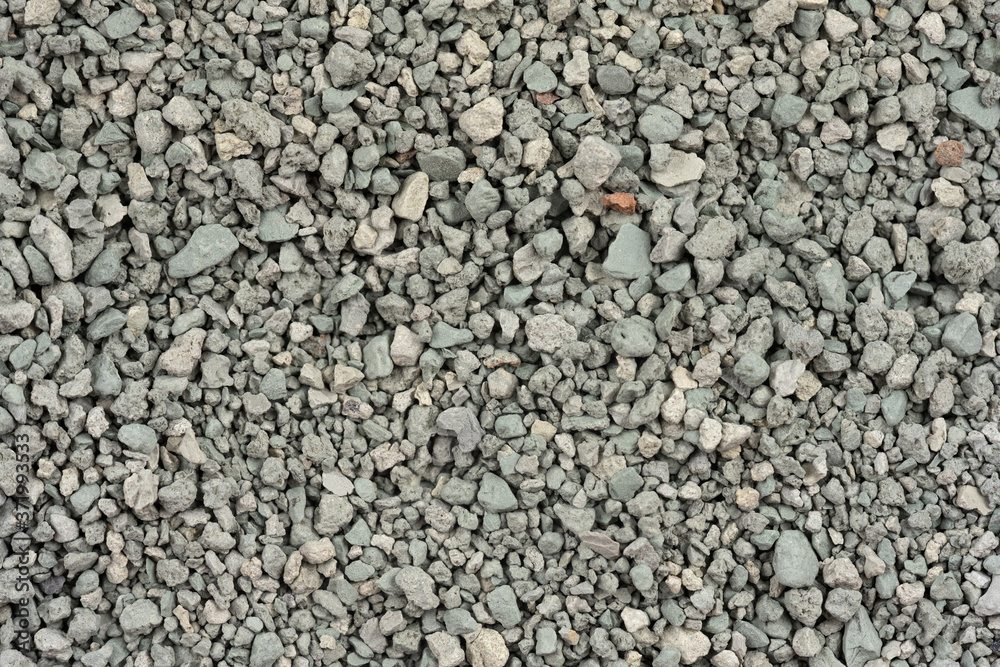 Gray small rocks ground texture. black small road stone background. gravel pebbles stone seamless texture. dark background of crushed granite gravel, close up. clumping clay Gray small rocks ground texture. black small road stone background. gravel pebbles stone seamless texture. dark background of crushed granite gravel, close up. clumping clay