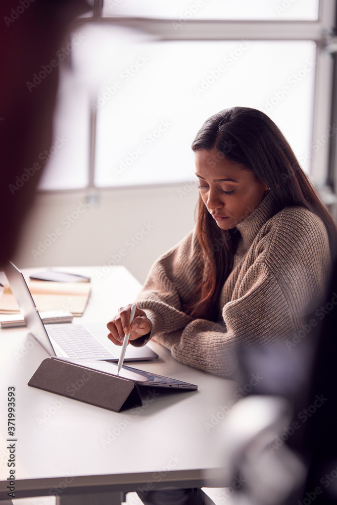 Businesswoman Working From Home Drawing On Digital Tablet Using Stylus Pen Businesswoman Working From Home Drawing On Digital Tablet Using Stylus Pen