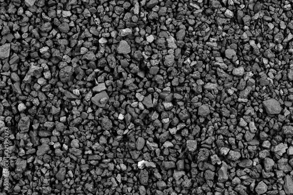 Gray small rocks ground texture. black small road stone background. gravel pebbles stone seamless texture. dark background of crushed granite gravel, close up. clumping clay Gray small rocks ground texture. black small road stone background. gravel pebbles stone seamless texture. dark background of crushed granite gravel, close up. clumping clay