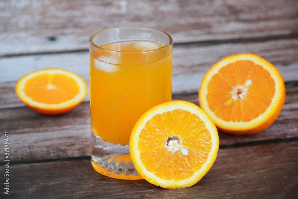 orange drink in a glass and orange slices orange drink in a glass and orange slices