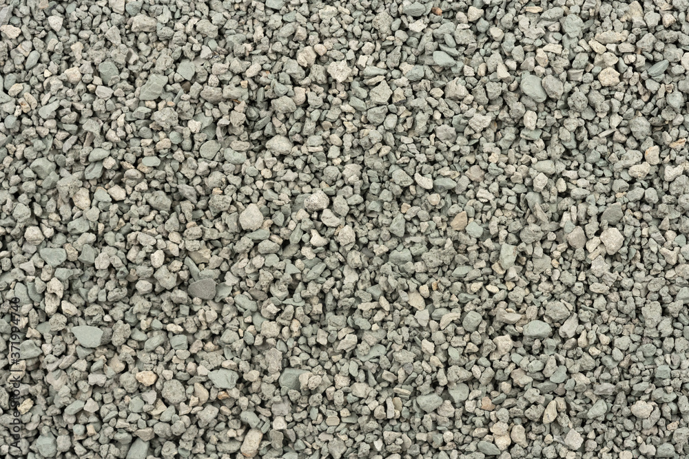 Gray small rocks ground texture. black small road stone background. gravel pebbles stone seamless texture. dark background of crushed granite gravel, close up. clumping clay Gray small rocks ground texture. black small road stone background. gravel pebbles stone seamless texture. dark background of crushed granite gravel, close up. clumping clay