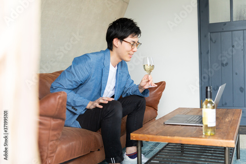 Young man at home enjoying a video call photo