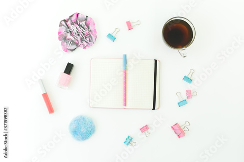 Resin art with diary, clips, lipstick, nail polish and tea cup on white background. Feminine concept. Flat lay