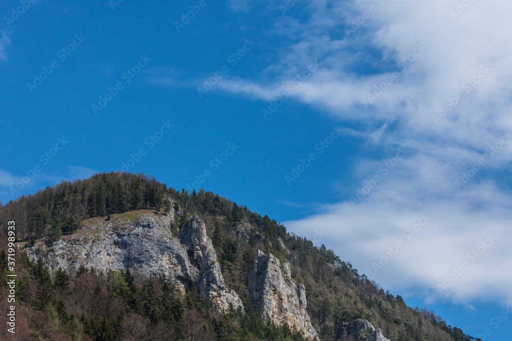 mountains rocks and trees with blue sky