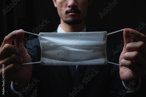 Businessman in suit wearing...