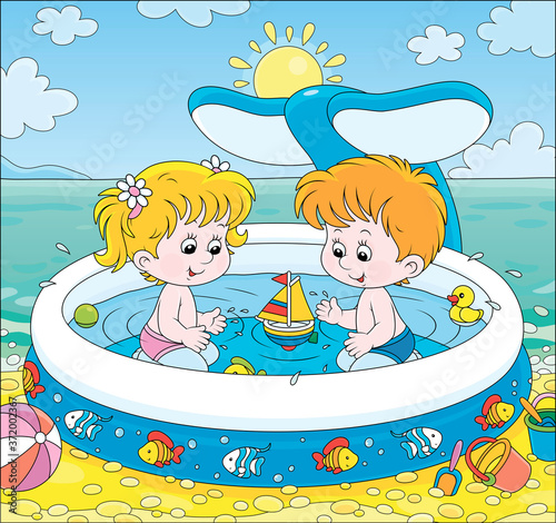 Happy little kids with toys playing in an inflatable paddling pool near water on a sea beach on a sunny summer day, vector cartoon illustration