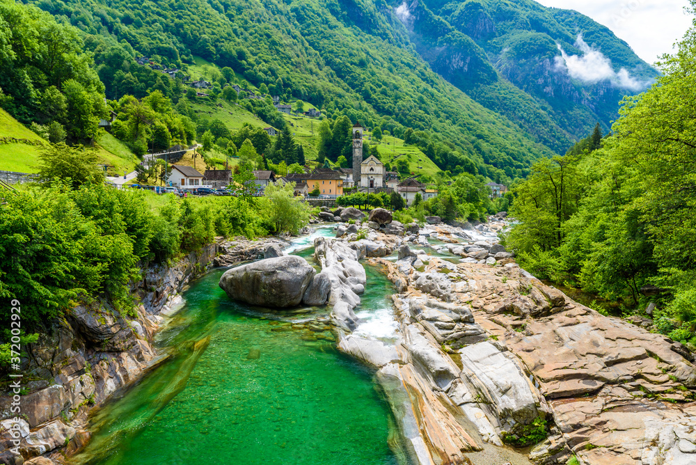 View from Bridge Ponte dei Salti to Verzasca River at Lavertezzo - clear and turquoise water stream and rocks in Ticino - Valle Verzasca - Valley in Tessin, Switzerland