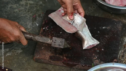 Fishermen are cutting fish for cooking. photo