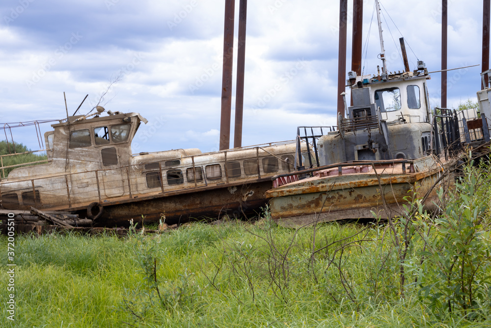 Old abandoned boat on the river. Old passenger boat.