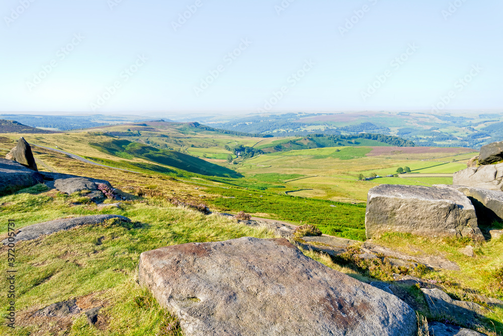 From Stanage Edge across the Derbyshire landscape in the morning sun